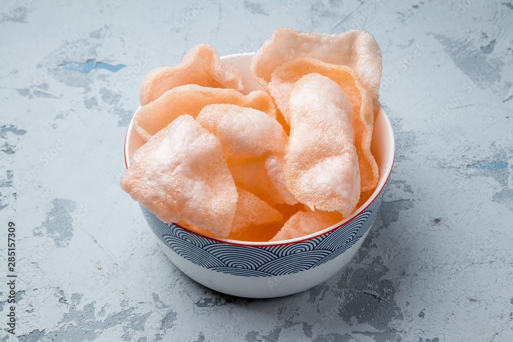 Fototapeta premium Vietnamese shrimp chips on grey concrete table