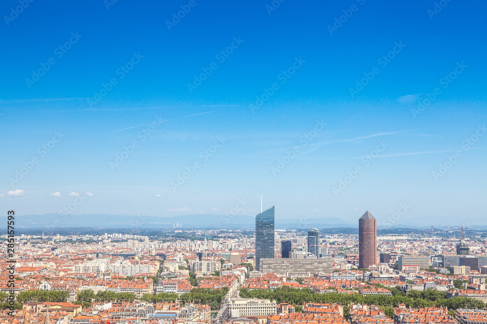 Aerial panoramic view of Lyon with the skyline of Lyon skyscrapers visible in background and Saone river in the foregroud, with the narrow streets of Old Lyon district