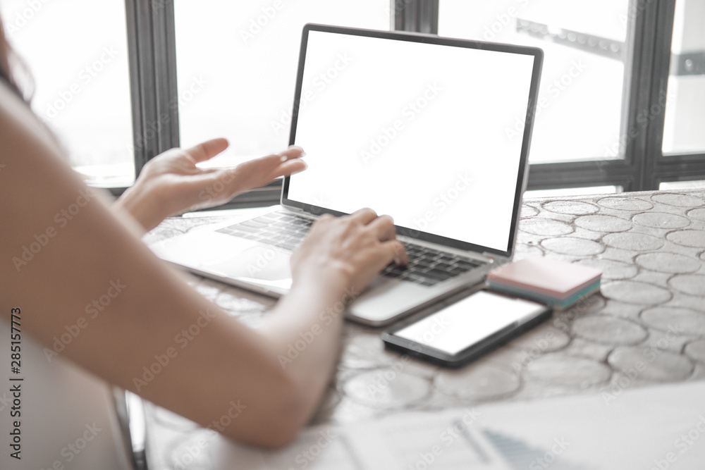 Mockup image of close up business woman working with smartphone laptop and documents in office, mockup concept Mockup image of close up business woman working with smartphone laptop and documents in office, mockup concept