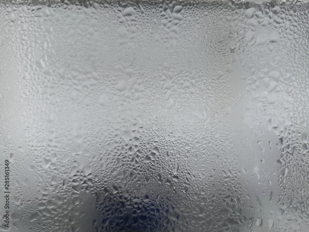 Texture of frozen water drops cool ice glass on background.Closeup. Texture of frozen water drops cool ice glass on background.Closeup.