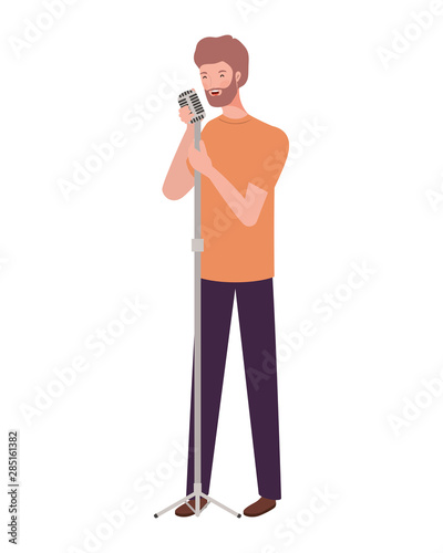 young man with microphone on white background photo