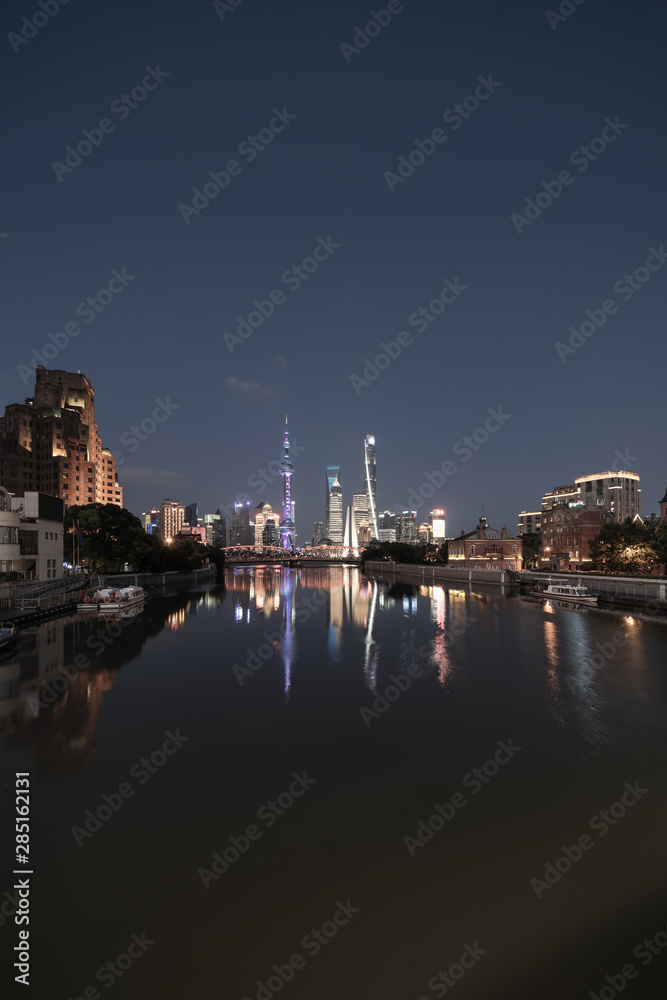 Cityscape and city skyline at night in Shanghai China.