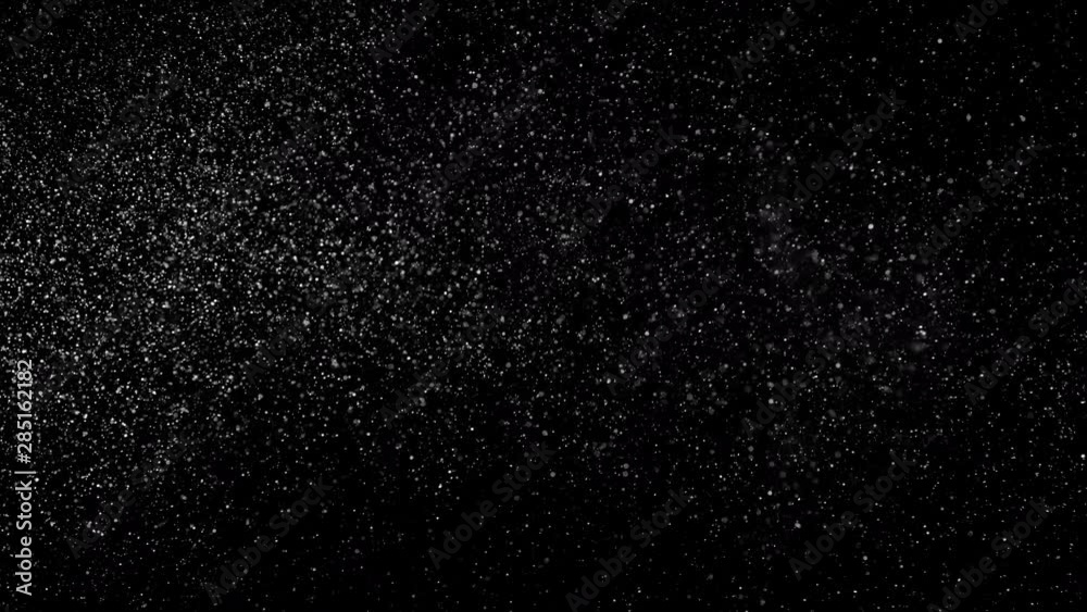 Fine particles slowly moving on black background Fine particles slowly moving on black background