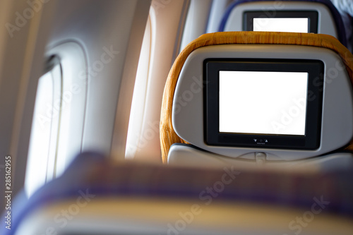 In-flight entertainment (IFE) in the ecomony class with empty screen isolated in white.  IFE screen background. photo