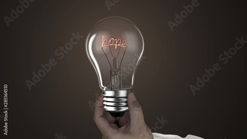 Hand holding lighting bulb lamp with hope words shape black dark background, 3D rendering animation, macro view