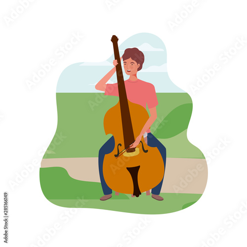 young man with fiddle in background landscape