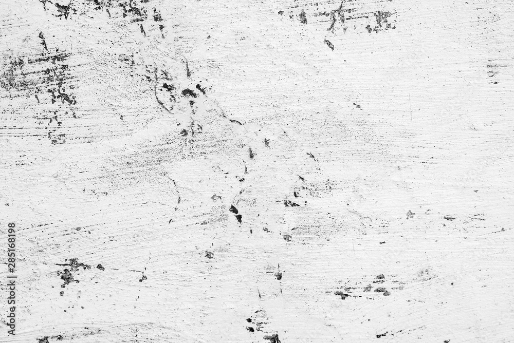 Fototapeta premium Texture of a concrete wall with cracks and scratches which can be used as a background