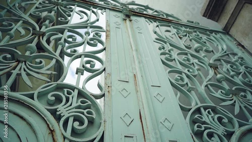 Iron Gate with rusty ornament camera traveling