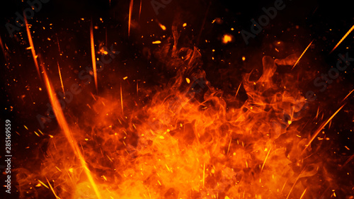 Realistic isolated fire effect for decoration and covering on black background. Concept of particles,flame and light.