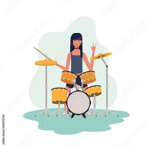 young woman with drum kit on white background