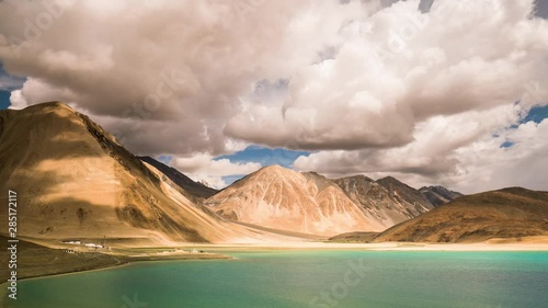 Stunning Pangong Tso, a saltwater lake 4250m altitude in Ladakh, bordering China with rolling clouds.