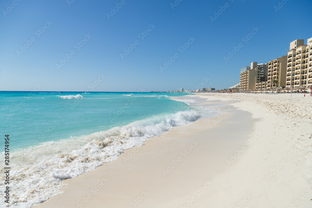 Mexico's most popular beach- Playa Delfines. Beautiful beach in Cancun, Zona Hoteliera. Caribbean coast, Yucatan, Mexico Mexico's most popular beach- Playa Delfines. Beautiful beach in Cancun, Zona Hoteliera. Caribbean coast, Yucatan, Mexico