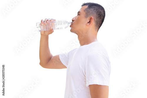 Man drinking water from bottle on white background