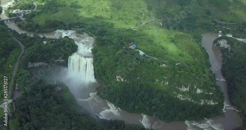 Scenic landscape, Huang Guo Shu waterfall in China. Super high up aerial drone shot captures surrounding area. 4K photo