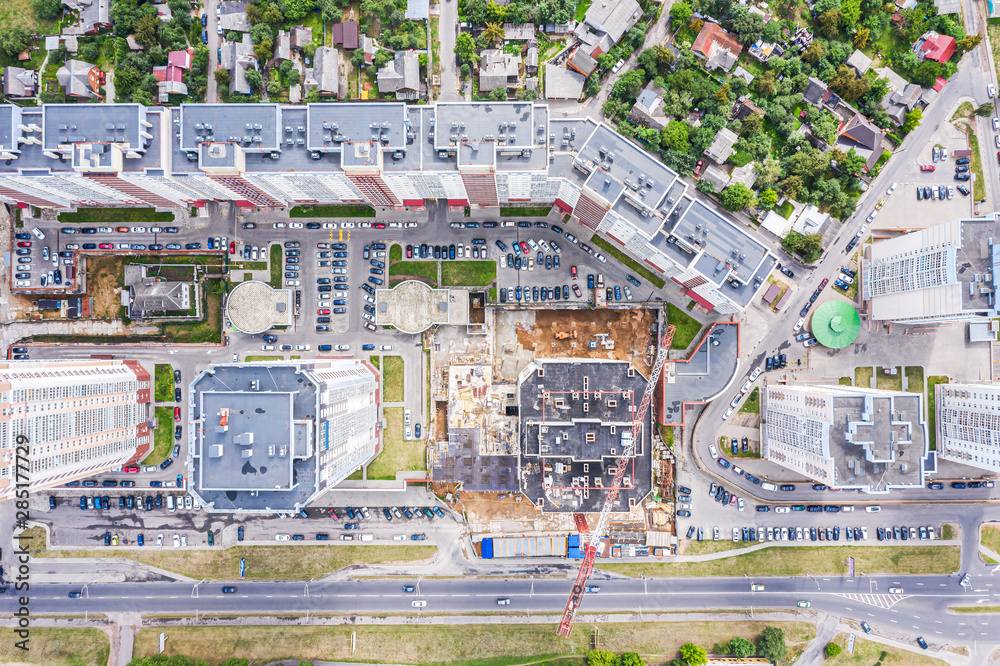 aerial top view of construction site with high crane. development of city residential area