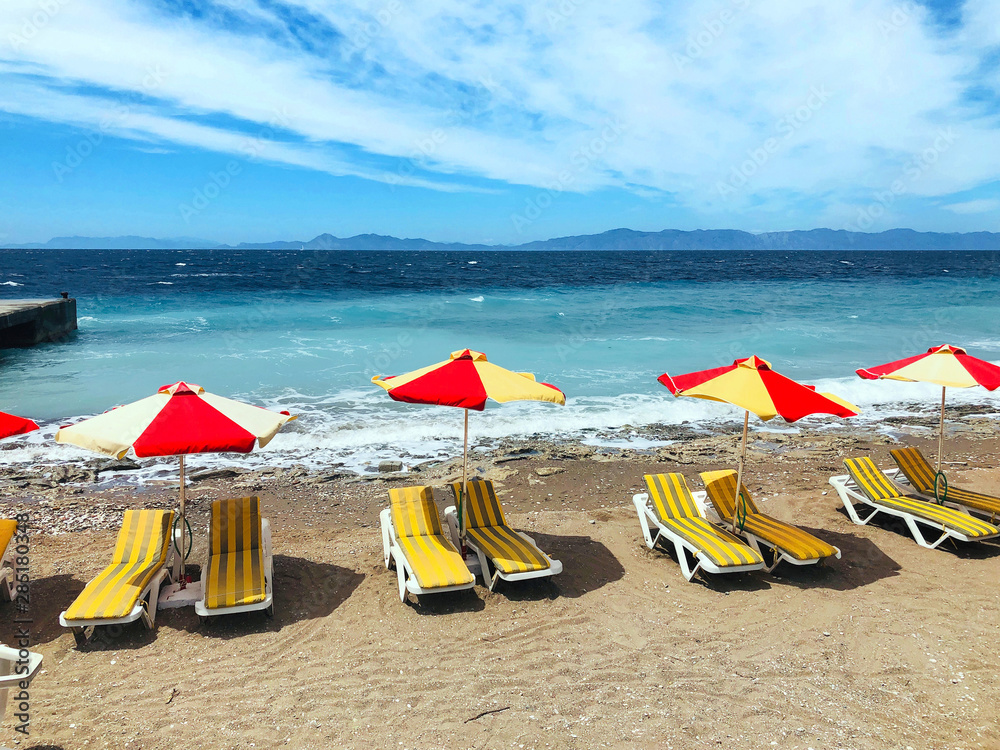Aegean sea coastline and beach in Rhodes Island, Greece Aegean sea coastline and beach in Rhodes Island, Greece