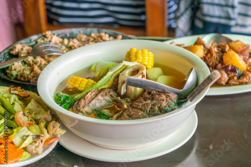 Delicious Philippines dinner meal with bulalo beef marrow and vegetables photo