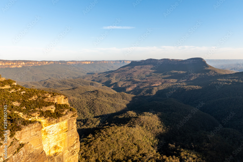 As the sun lowers in the horizon, the colours cast themselves across the valleys of the Blue Mountains in NSW, Australia