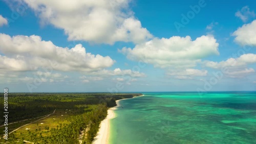 Hyperlapse: Running clouds in the blue sky over the blue sea and tropical island. Summer and travel vacation concept. photo