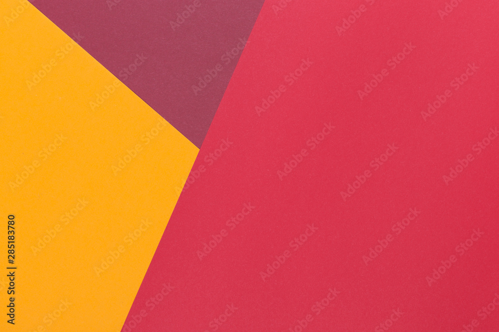 Paper yellow, burgundy, red empty background, geometrically located. Color blank for presentations, copy space.