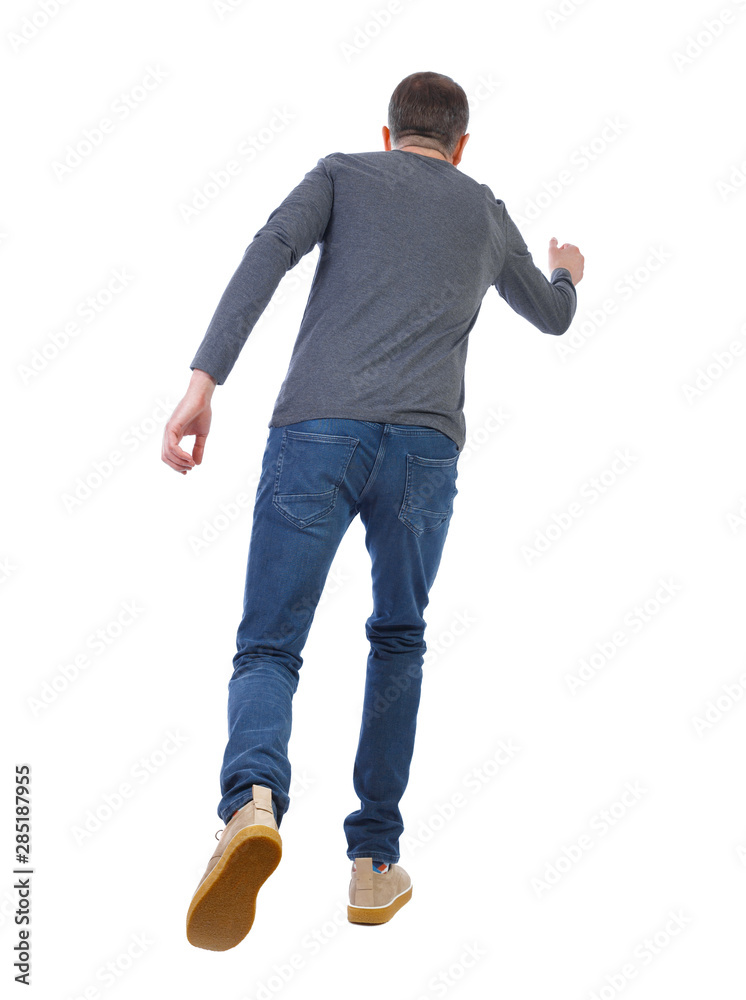 Fototapeta premium back view of running man. backside view of person.