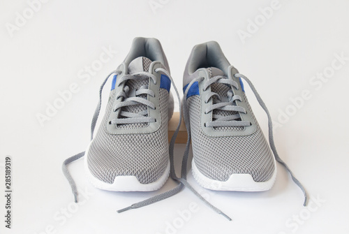 gray men's sneakers on a white background