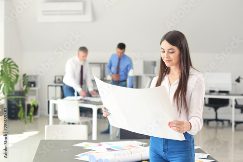 Beautiful female architect in office