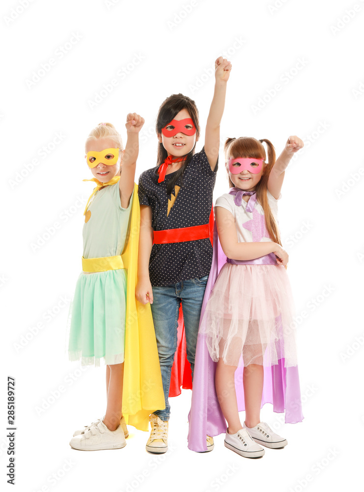 Fototapeta premium Cute little children dressed as superheroes on white background