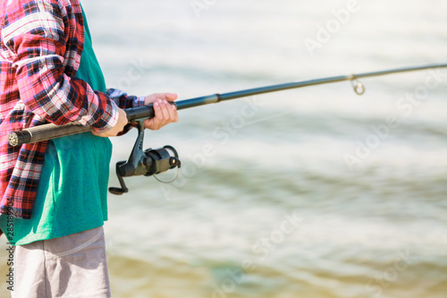 Cute little boy fishing on river