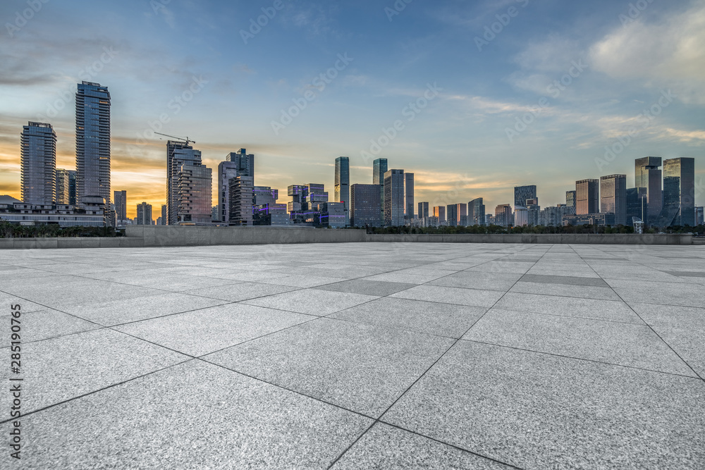 Panoramic skyline and buildings with empty square floor.