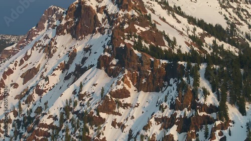 Aerial Oregon Crater Lake Snowy May 2019 Sunset 90mm Zoom 4K Inspire 2  Aerial video of Crater Lake National Park during a beautiful sunset with snow with a zoom lens. photo