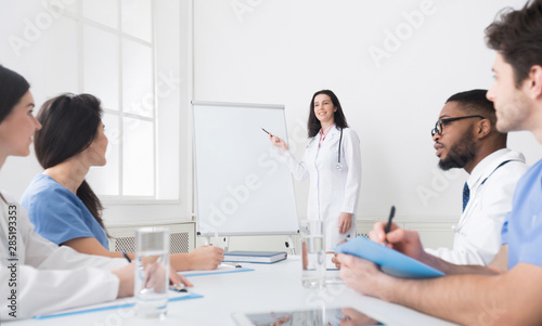 Practitioner giving lecture for colleagues in clinic