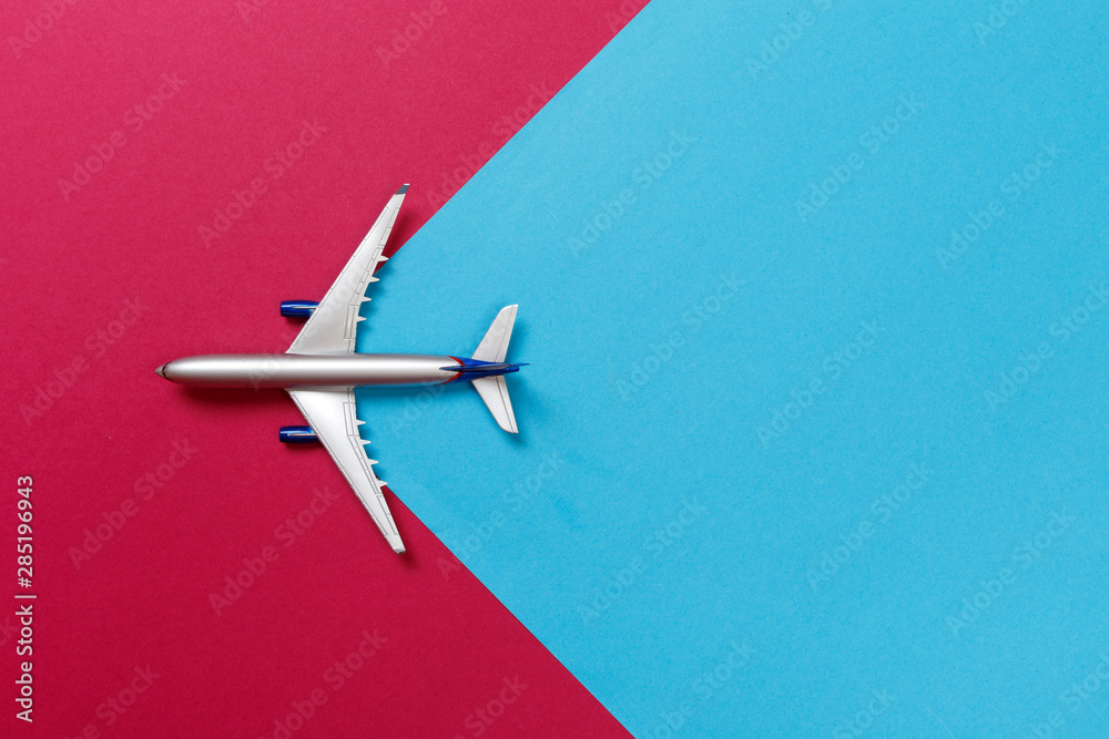 top view photo of toy airplane over color background . travel concept . top view photo of toy airplane over color background . travel concept .