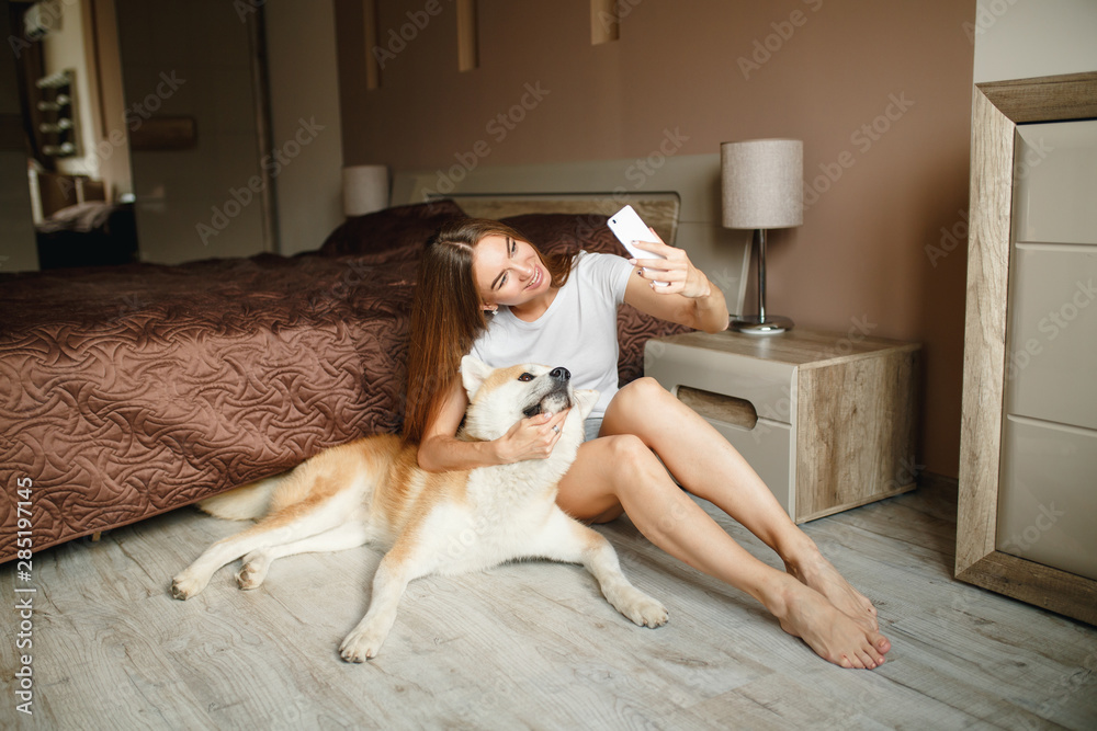 Girl taking a selfie with her dog. Pretty girl and her dog taking a ...