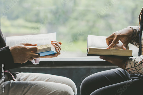 Christians and Bible study concept.Two men studying the bible.