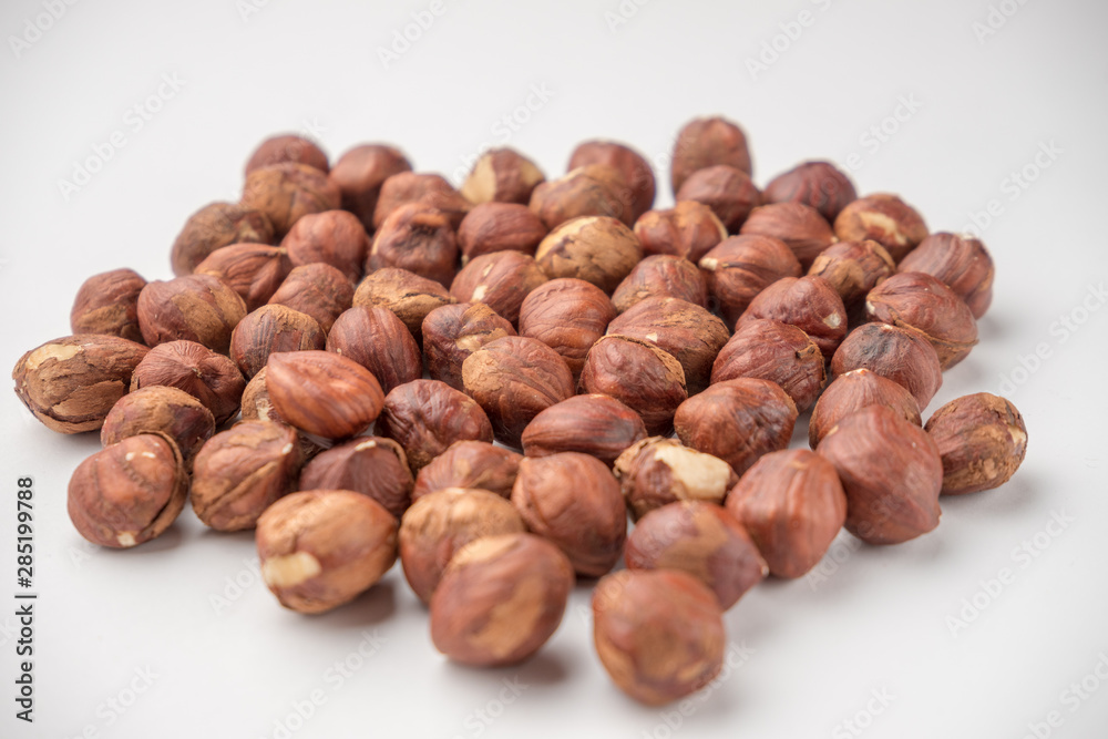 nutritious nuts, hazelnuts on a white background nutritious nuts, hazelnuts on a white background