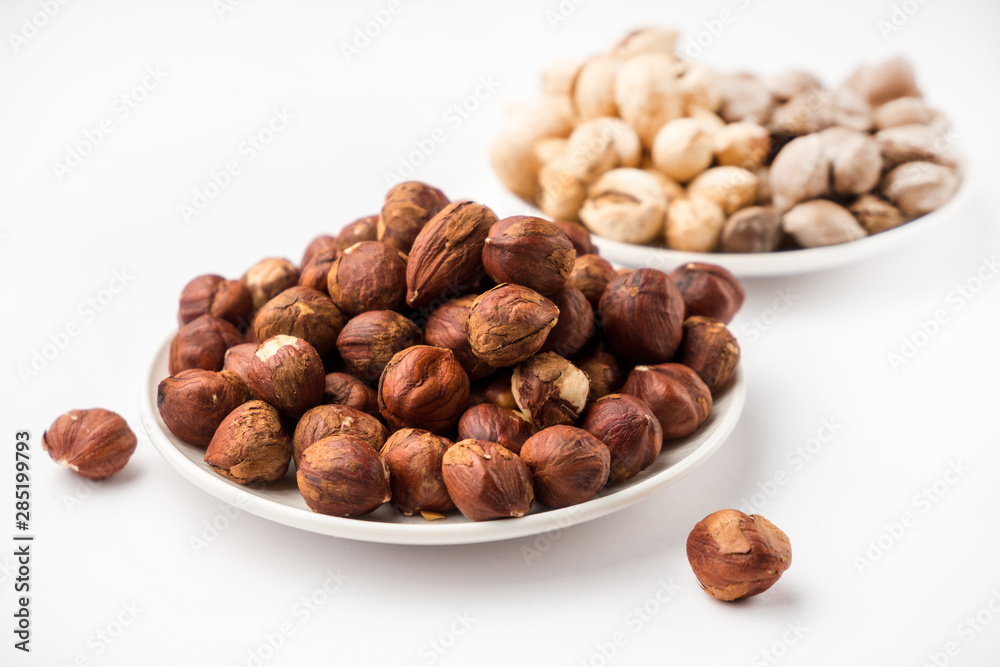 nutritious nuts, hazelnuts on a white background nutritious nuts, hazelnuts on a white background