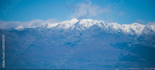 View of the mountains on a clear winter day where the blue sky and mountains predominate
