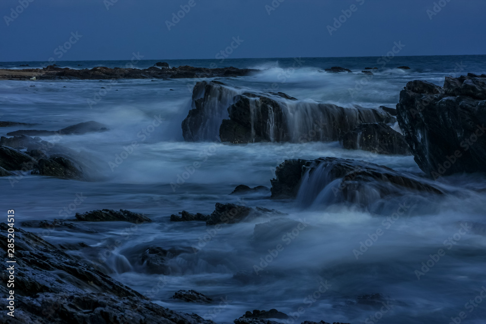 Big waves crashing on rocks