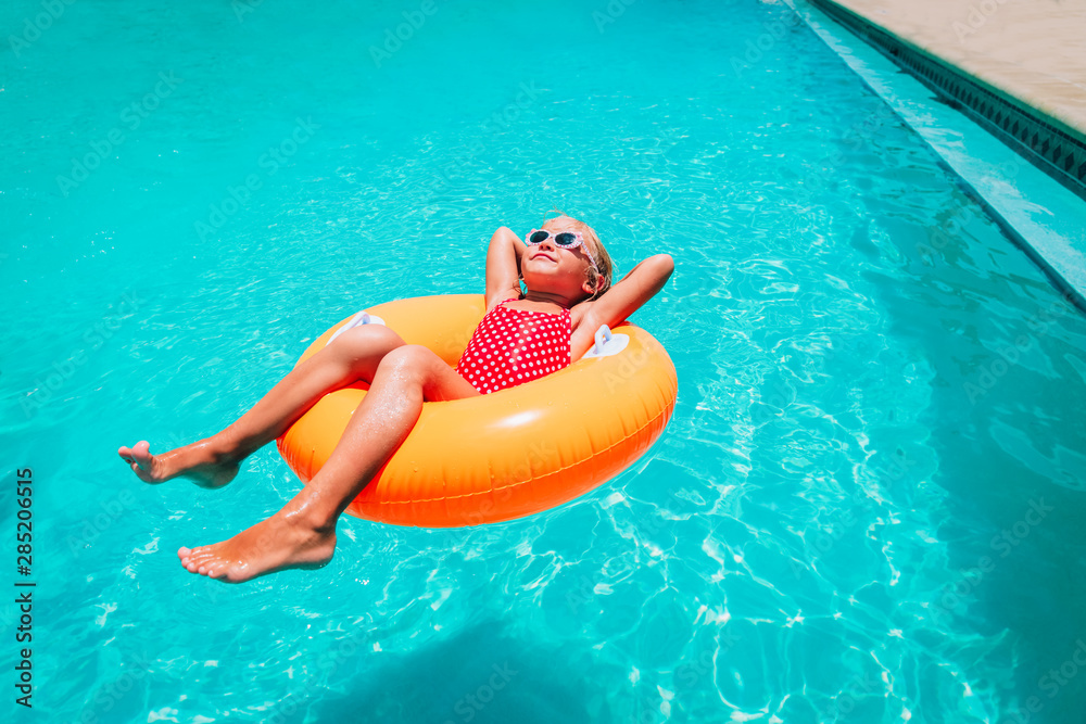 Tween Floating Inpool cute little girl have fun at the pool, child relax in floatie Stock ...