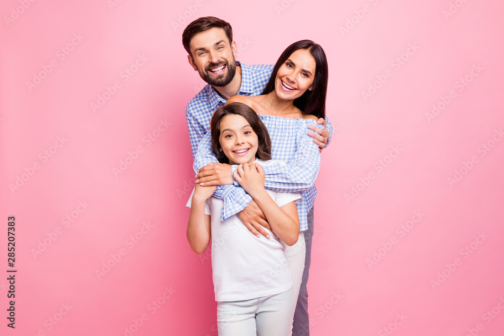 Portrait of cheerful family cuddling smiling wearing checkered plaid shirt off-shoulders white t-shirt isolated over pink background Portrait of cheerful family cuddling smiling wearing checkered plaid shirt off-shoulders white t-shirt isolated over pink background