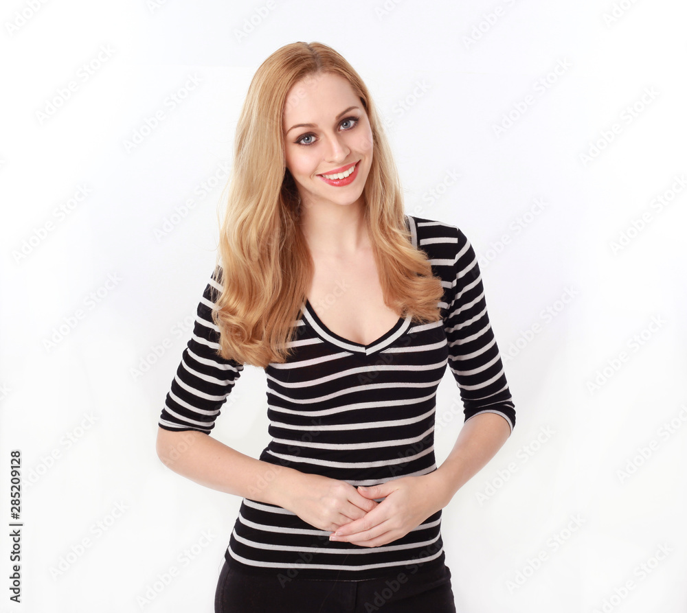 3/4 portrait of pretty blonde lady wearing stripes shirt, isolated against a white studio background. 3/4 portrait of pretty blonde lady wearing stripes shirt, isolated against a white studio background.
