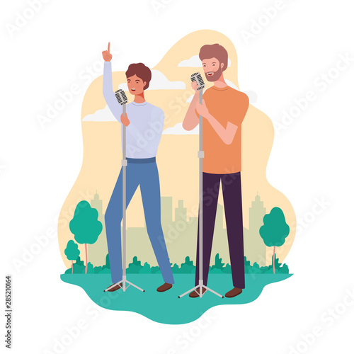 men standing with microphones and background landscape photo