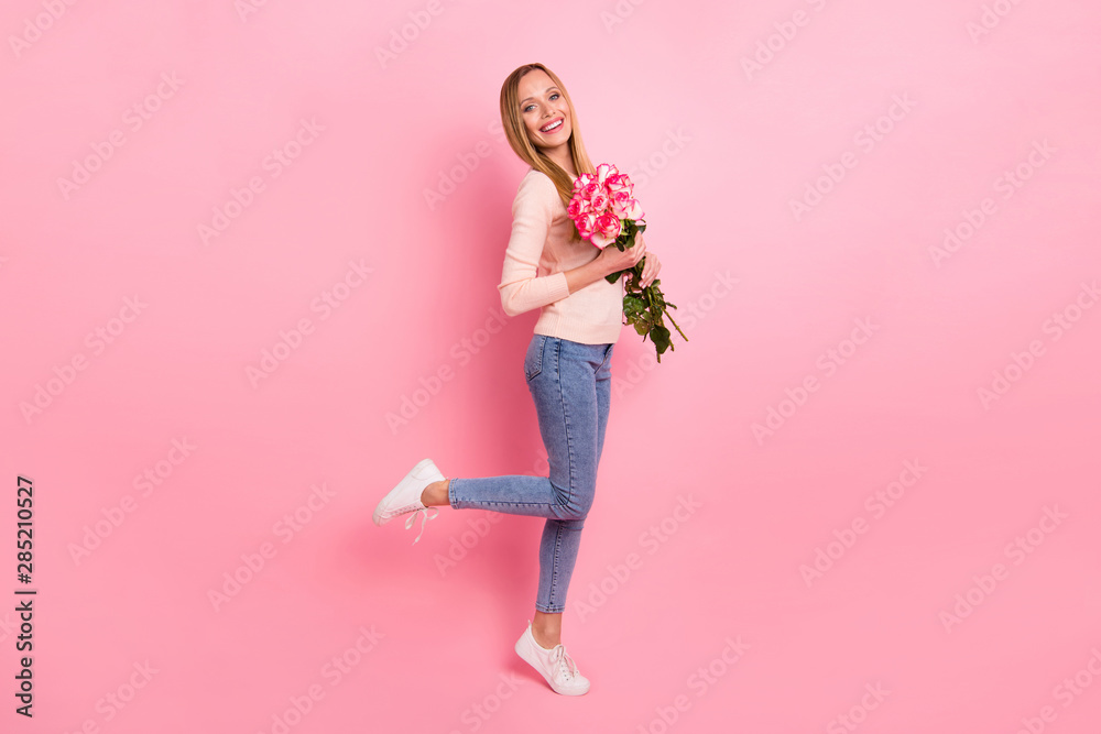 Full size photo of candid person people celebrate anniversary hold hand flora isolated over pink background Full size photo of candid person people celebrate anniversary hold hand flora isolated over pink background