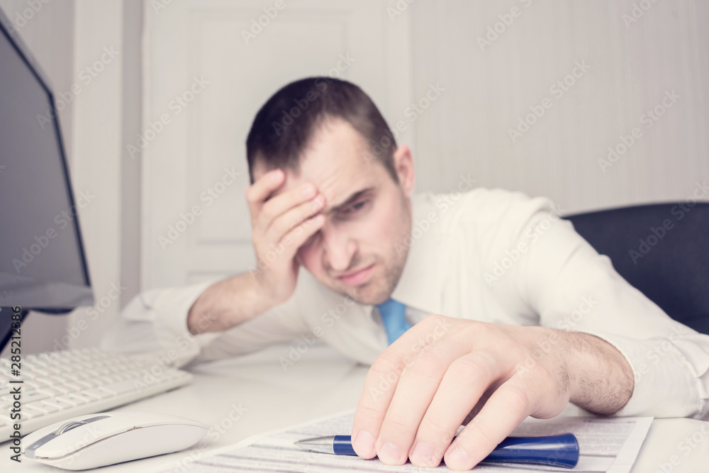 Businessman is very tired at work, weary man fell asleep at work, close up, toned Businessman is very tired at work, weary man fell asleep at work, close up, toned