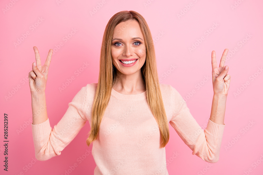 Portrait of charming attractive youth make v-signs feel glad travel trip isolated over pink background Portrait of charming attractive youth make v-signs feel glad travel trip isolated over pink background