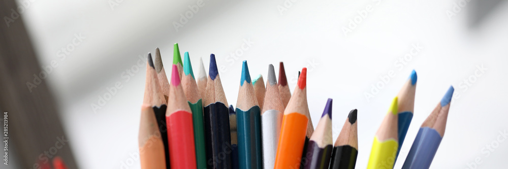 Bunch of various pencils stand in holder macro view Bunch of various pencils stand in holder macro view