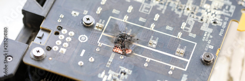 Closeup view of damaged graphic adapter burnt out after hack attack photo