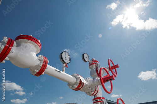 Oil, gas industry. Group wellheads and valve armature photo