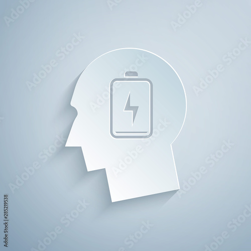 Paper cut Male head with low battery icon isolated on grey background. Tired man. Paper art style. Vector Illustration